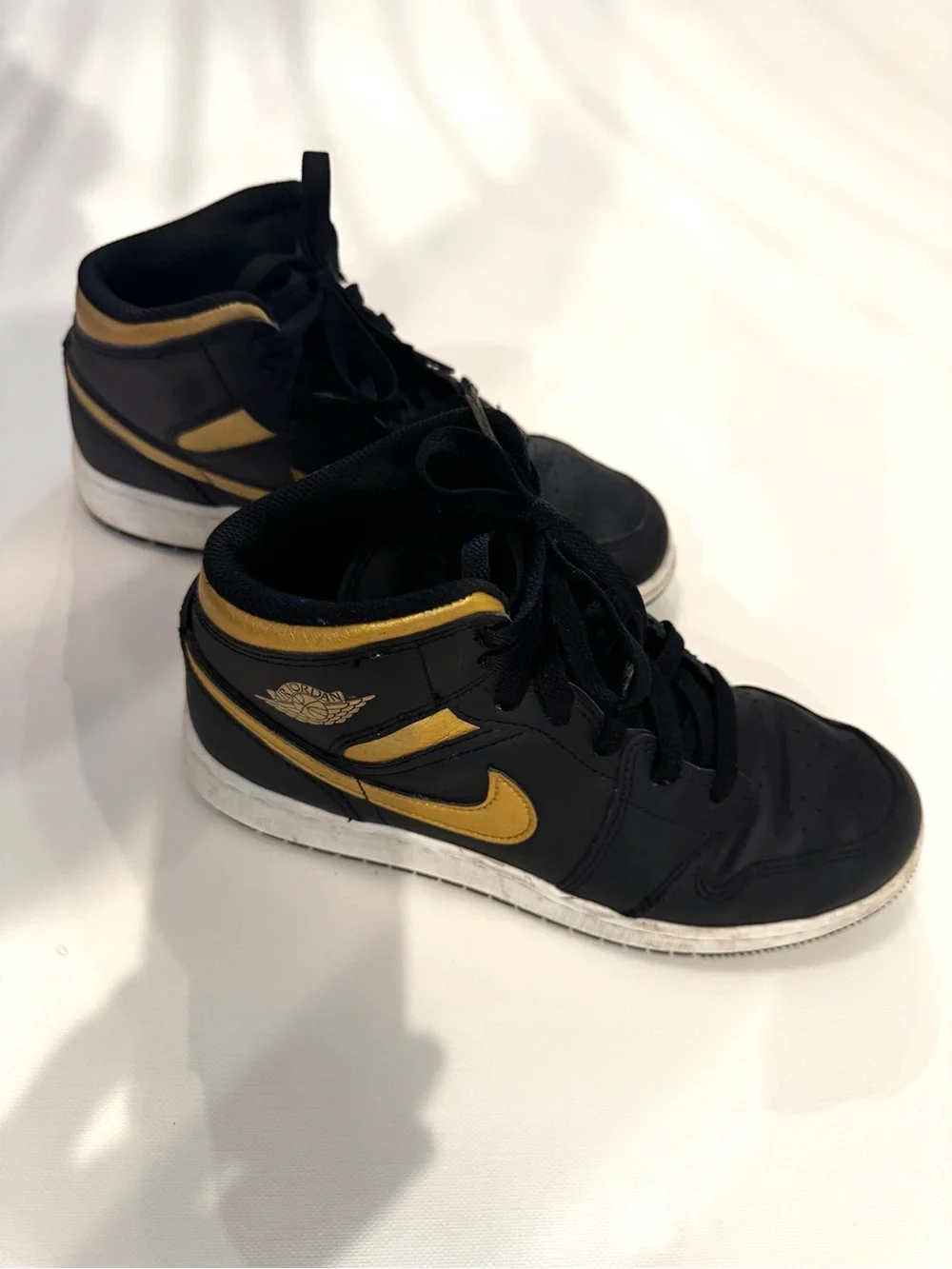 Nike Air Jordan 1 Mid Black with Gold Swoosh